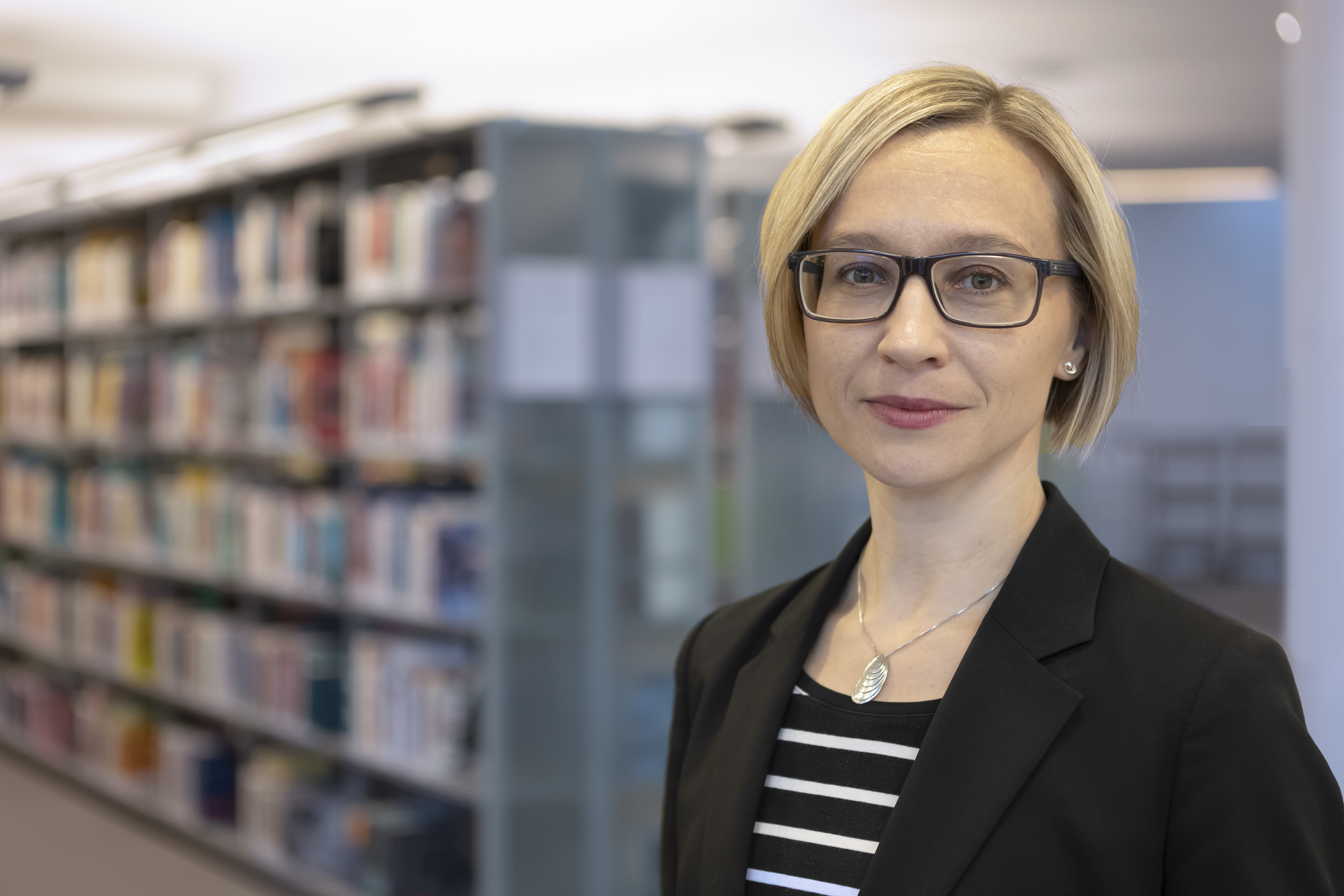Portrait photo of Anna at a library